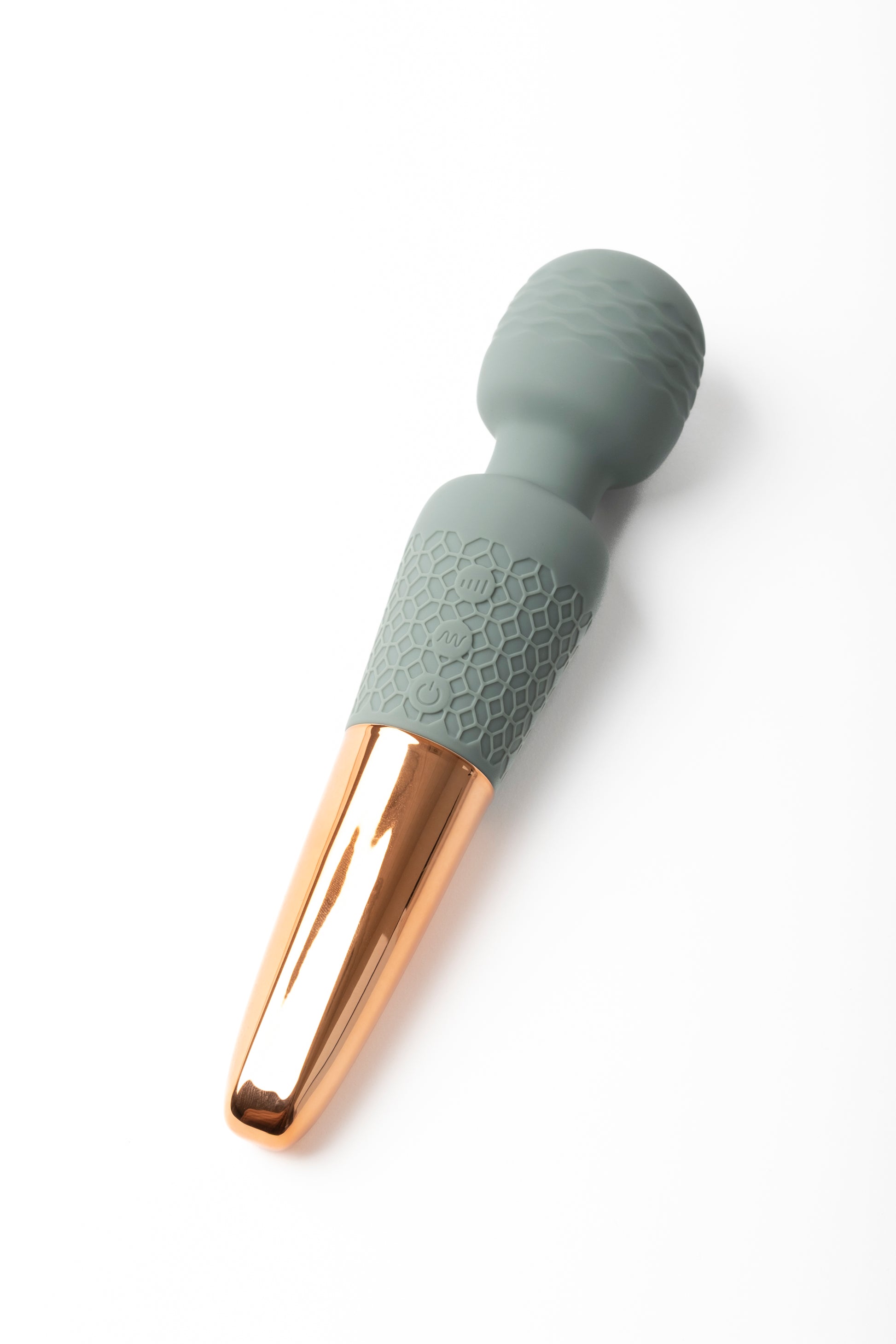 Soft, waterproof personal wellness massager with a textured silicone handle and gold-toned base, designed for gentle relaxation and everyday self-care.