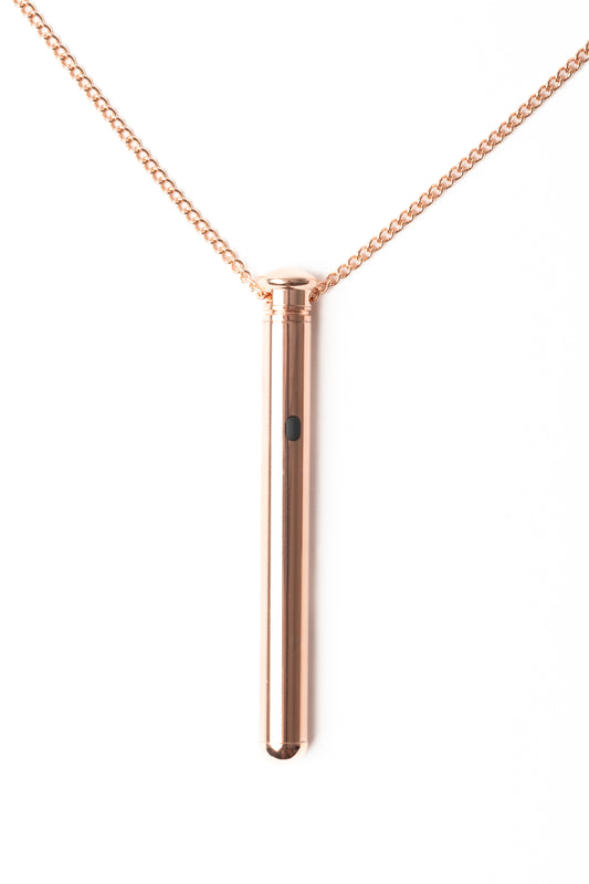 Elegant rose gold wellness pendant with minimalist design, crafted for modern self-care and relaxation. A refined accessory blending style and purpose.