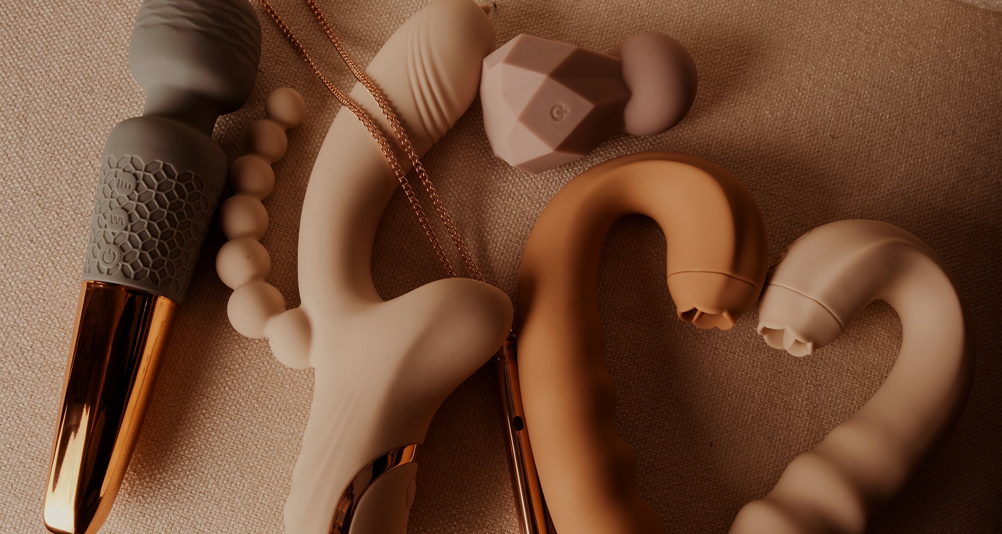 Discover premium wellness massagers in soft beige tones, crafted from smooth silicone with elegant design and gold details for ultimate relaxation.